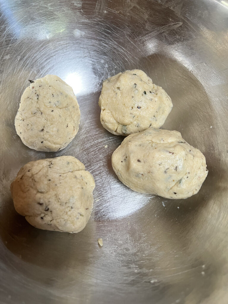 Split the dough ball into 4 small balls