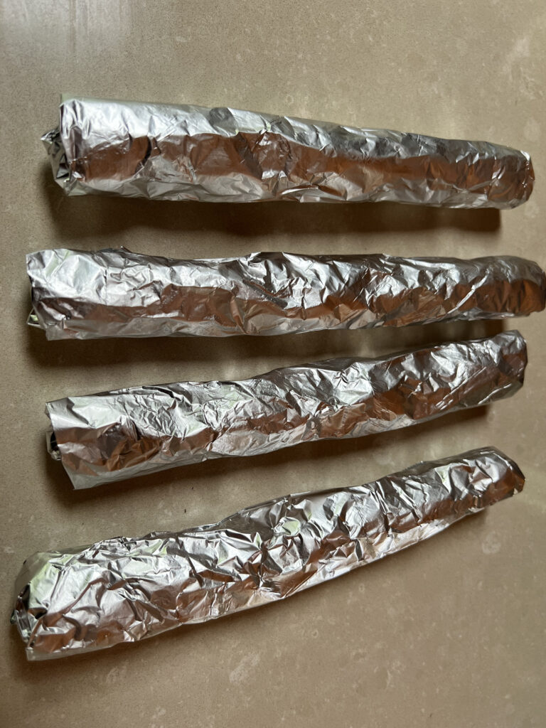 Bread sticks in aluminium foil