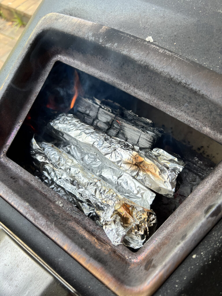 Bread sticks cooking in a fire