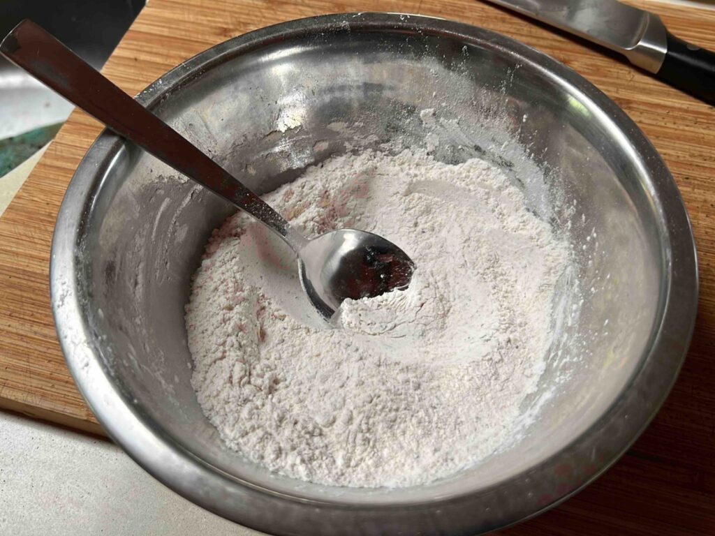 Flours and spices combined in a bowl